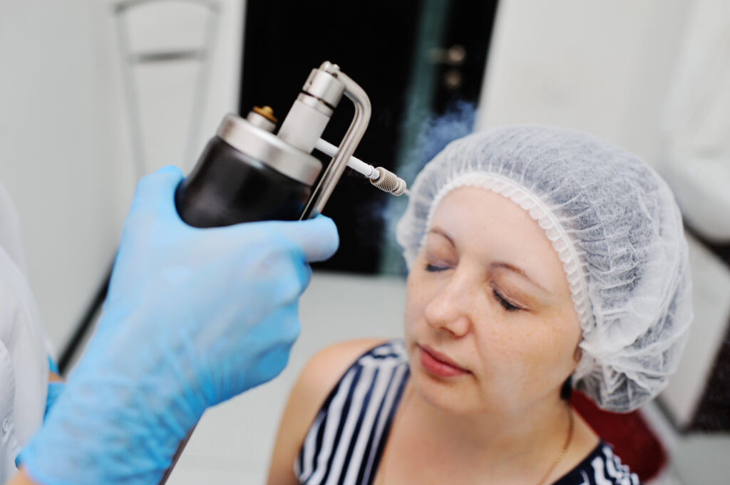 woman receiving cryo facial treatment for skin